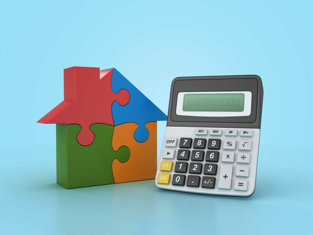 A visual representation of the concept of homeownership and financial planning, with a puzzle piece house symbolizing homeownership and a calculator symbolizing financial calculations.